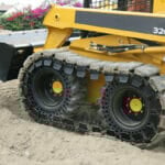 over the tire skid steer tracks on the skid loader