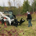 skid steer with a wood chipper