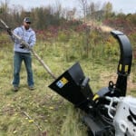 feeding wood chipper