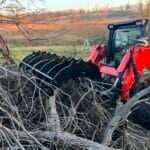 industrial grapple rake grabbing trees