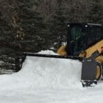 snow pusher in the field
