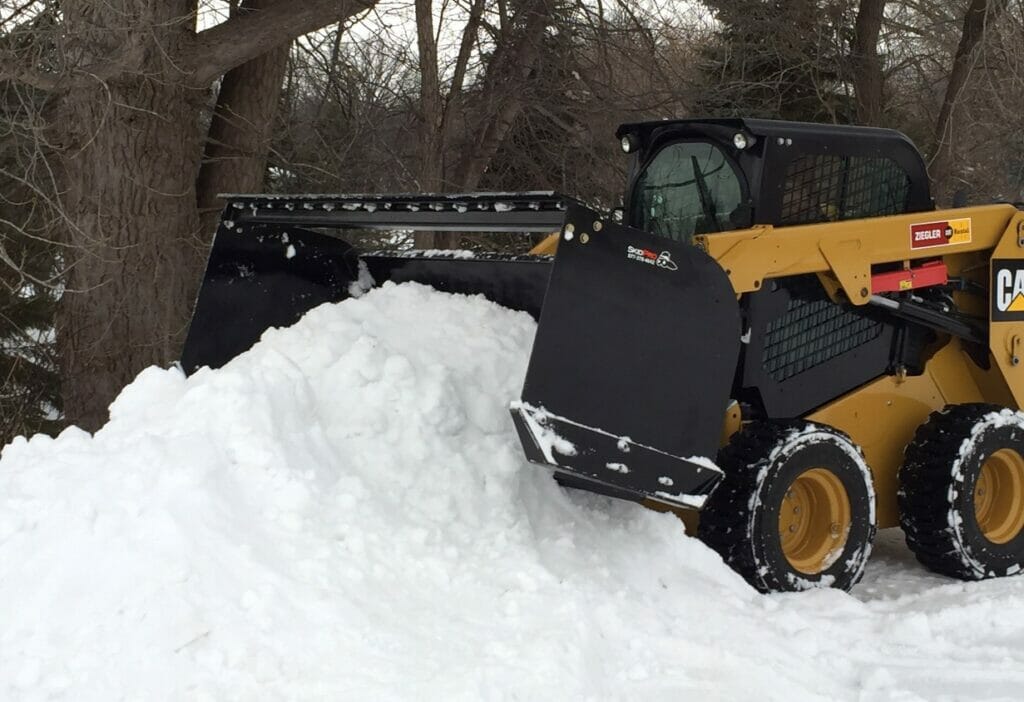 piling snow with track loader