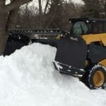 piling snow with track loader