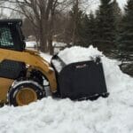 snow pusher in field
