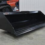 skid steer bucket on ground