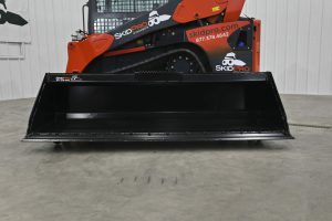 Skid Steer Dirt Bucket in shop
