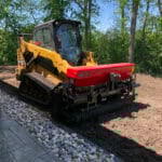 planting seed with skid steer