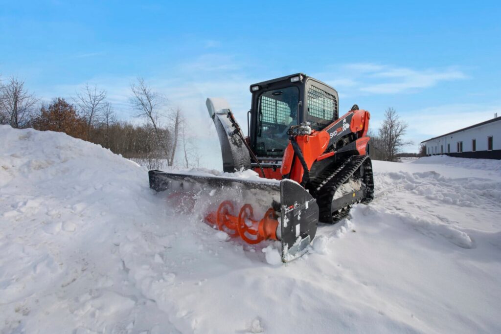 snow blower cutting through pile