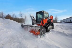snow blower cutting through pile