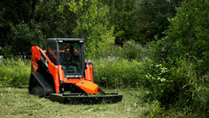 skid steer brush mower in the field