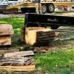 Splitting log with skid steer