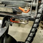 stump grinder hose retainer