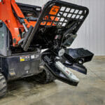 skid steer tree shear in shop