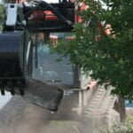 backhoe picking up debris