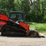 land leveler on dirt road