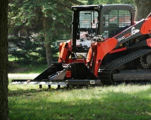 land leveler with scarifier teeth working