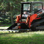 land leveler with scarifier teeth working