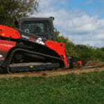 land leveler working in gravel