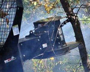 tree saw cutting from behind