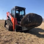 stump bucket with big rock