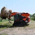picking up hay bale