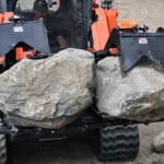 skeleton grapple with rocks