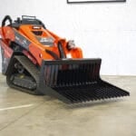 rock bucket on mini skid steer