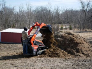 mini skid steer dirt bucket cleaning