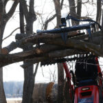 skid steer mini rock grapple with logs