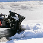 skid steer mini snow blade in snow
