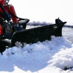 mini skid steer snow blade pushing snow