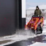 mini angle broom sweeping up snow