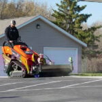 angle broom sweeping dirt