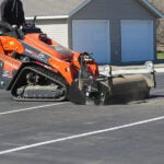 mini pickup broom picking up dirt