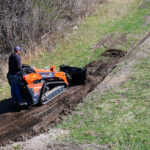 mini dozer blade pushing dirt