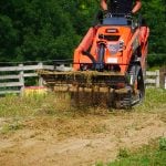 land leveler sifting dirt