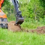 backhoe with rock