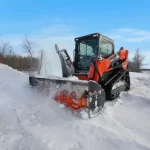 snow blower cutting through pile