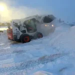 pushing snow with bucket