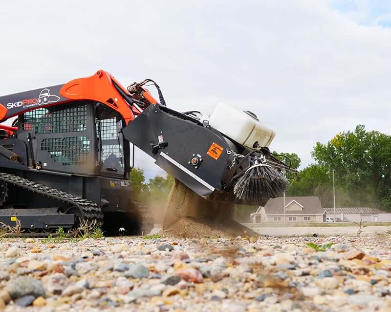 Skid Steer Pick Up Broom dumping debris