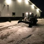 Skid Steer Snow Bucket In Field