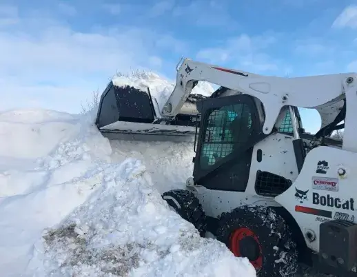 Skid Steer Snow Bucket In Field