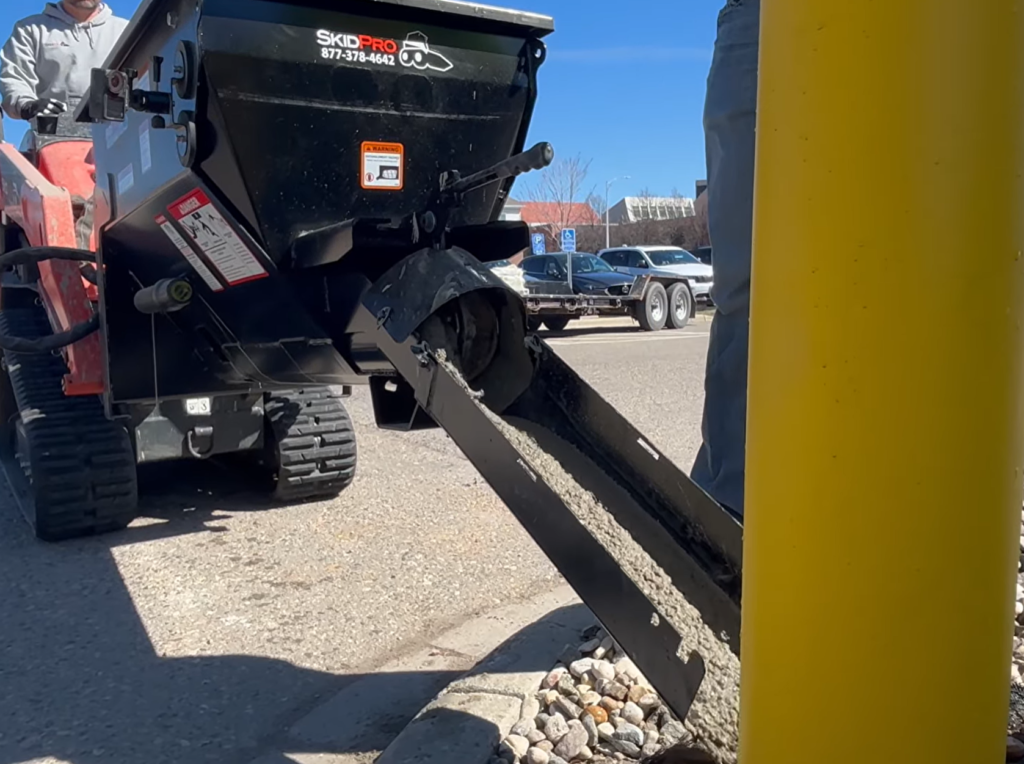 24 inch multi-link chute pouring concrete from the mini mixing bucket