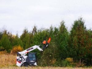 How to Clear Small Trees With a Skid Steer Disc Mulcher